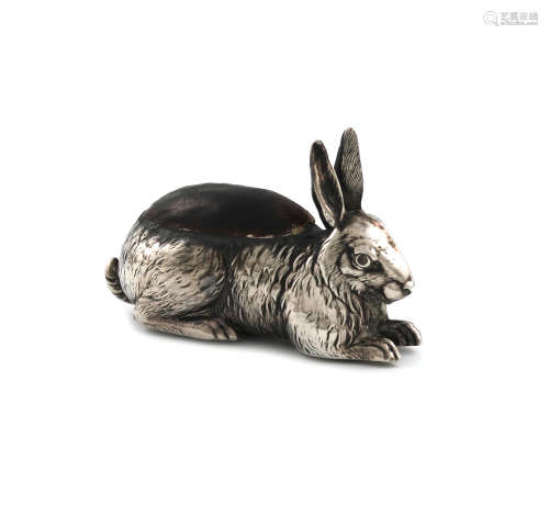 An Edwardian silver novelty rabbit pin cushion, by H. Matthews, Birmingham date letter worn,