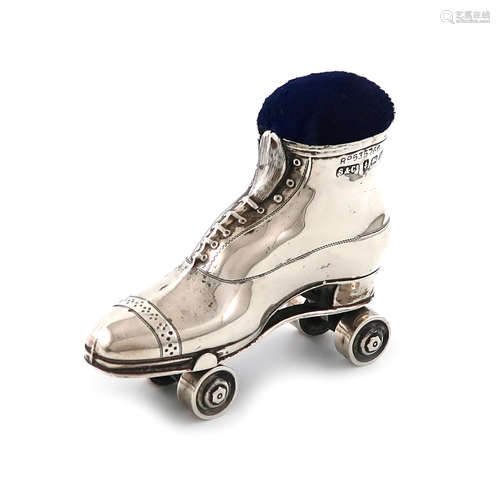 An Edwardian novelty silver roller skate pin cushion, by Serle and Co., Birmingham 1909, length