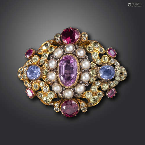 A mid 19th century gem-set gold lozenge brooch, set with a central pink topaz in half-pearl surround