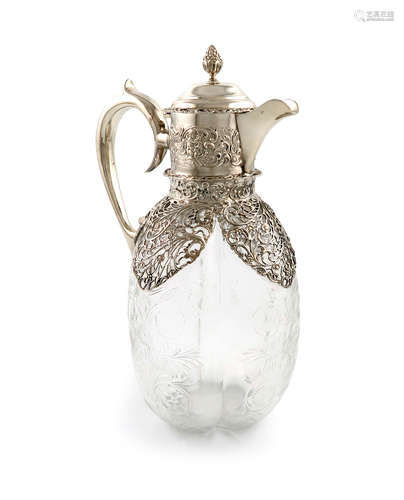 An Edwardian silver-mounted glass decanter, by William Comyns, London 1904, lobed ovoid form, etched