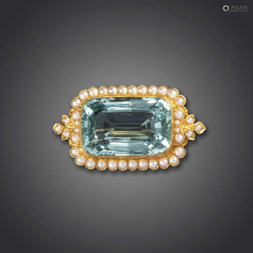 A late Victorian aquamarine and seed pearl brooch, the large cushion-shaped aquamarine set within