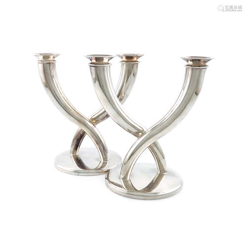 By Christofle, a pair of French electroplated two-light candelabra, tapering scroll arms, on