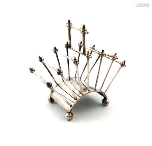 After Christopher Dresser, an electroplated seven bar toast rack, maker's mark of T.W, fan shape,