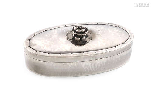 By Georg Jensen, a Danish silver dressing table box and cover, design no. 79, oblong form, spot-