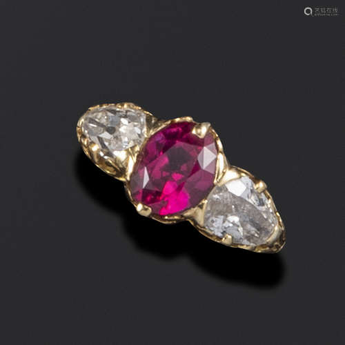 A Victorian ruby and diamond three-stone ring, set with an old oval-shaped ruby and two old pear-