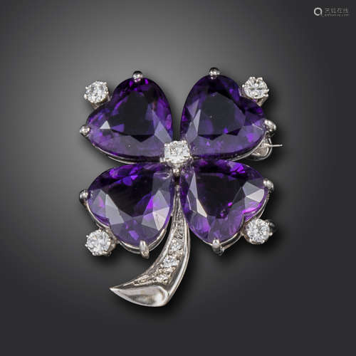 An amethyst and diamond-set shamrock brooch, set with heart-shaped amethysts and circular-cut