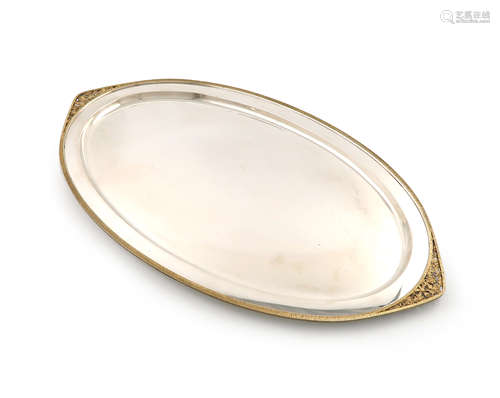 By Stuart Devlin, a modern parcel-gilt silver two-handled tray, London 1982, oval navette form, with