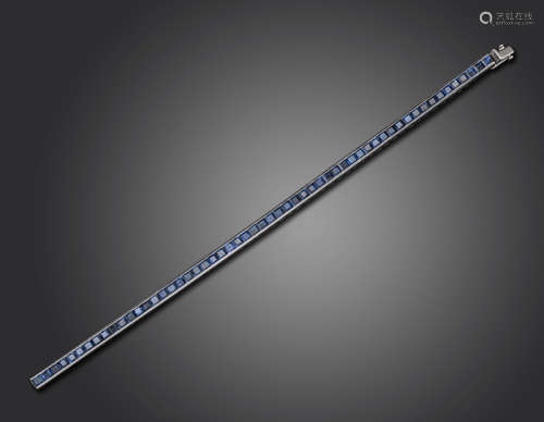 A sapphire line bracelet, the calibre-cut sapphires channel-set in platinum, 4mm wide, 18cm long