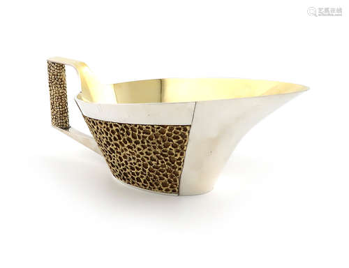 By Stuart Devlin, a large modern parcel-gilt silver sauce boat, London 1969, tapering oval form,