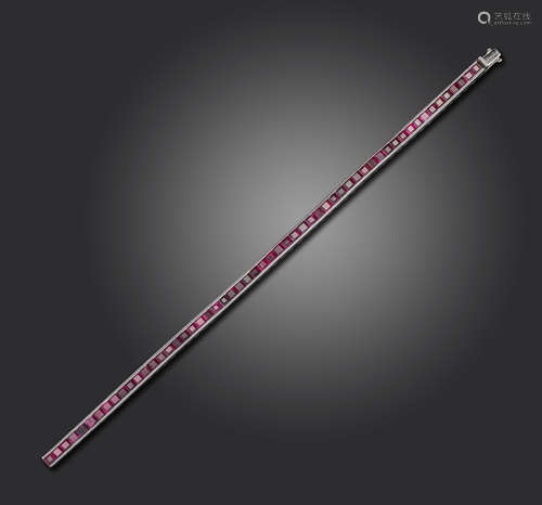 A ruby line bracelet, the calibre-cut rubies channel-set in platinum, 4mm wide, 18.2cm long