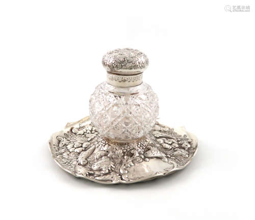 A Victorian silver inkstand, by Charles Boyton, London 1888, circular form, embossed with foliate
