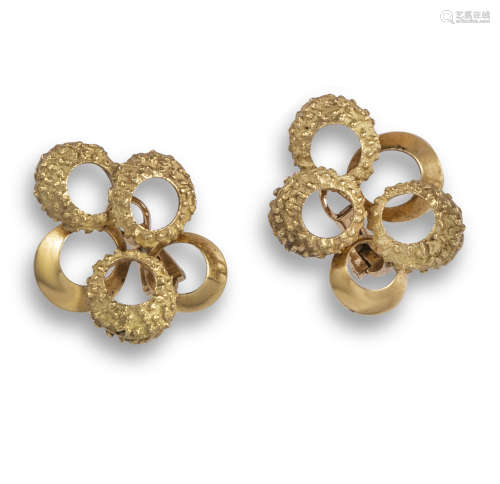 A pair of textured gold earrings by Chaumet, the overlapping textured and smooth gold circles, in