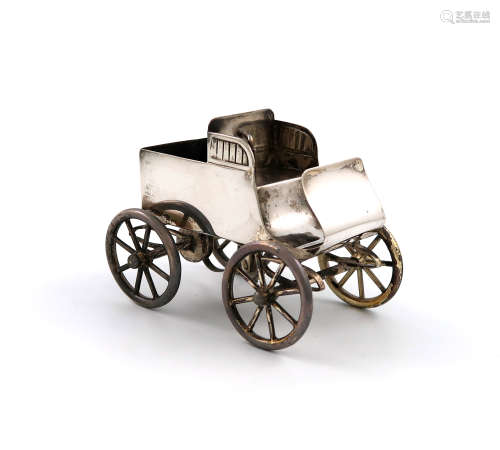 A novelty electroplated table vesta holder, unmarked, modelled as an early vintage car with a