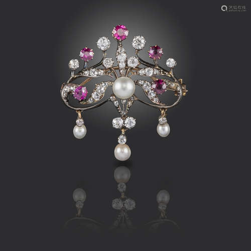 A Victorian ruby, pearl and diamond brooch, of scrolling form, suspending three articulated pearl