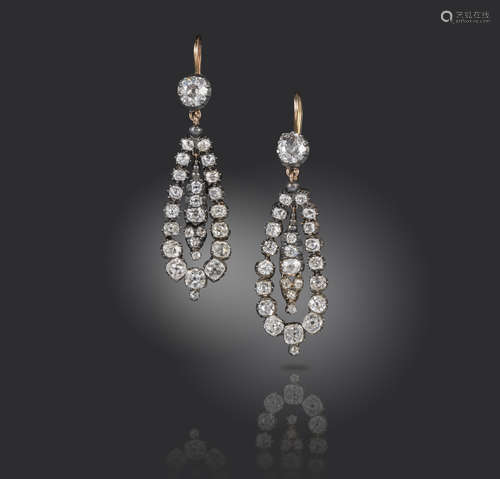 A pair of 19th century diamond drop earrings, set with graduated old cushion-shaped diamonds in