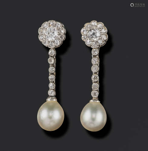 A pair of late 19th century natural pearl and diamond drop earrings, the pearls suspend from