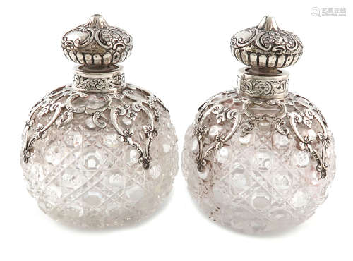 A pair of Victorian silver-mounted cut-glass scent bottles, by J. Rosenthal, London 1892, globular