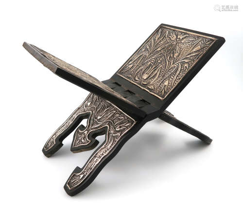 A middle-eastern metalware mounted wooden Koran stand, marked 800, hinged X-frame form, with