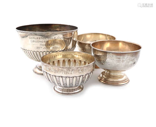 A collection of four silver trophy bowls, comprising: one of circular form, with fluted