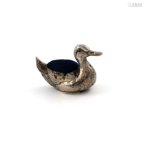 A novelty silver duck pin cushion, by Crisford and Norris, Birmingham 1922, modelled in a swimming