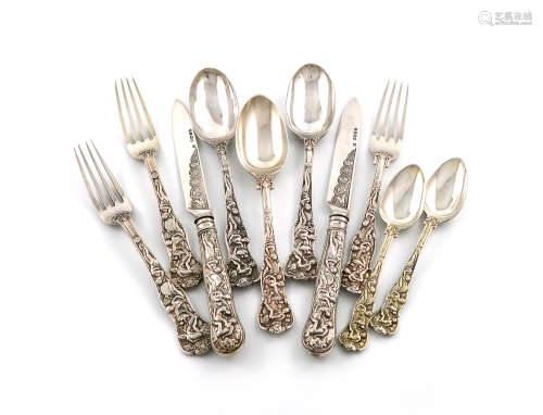 A collection of Victorian silver and silver-gilt Bacchanalian pattern flatware, by George Adams,
