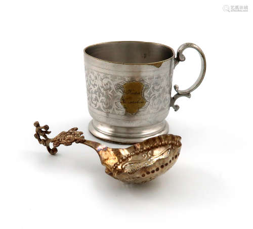 A Dutch silver sifting spoon, circa 1900, circular pierced bowl, wavy-edge border, with a scroll and