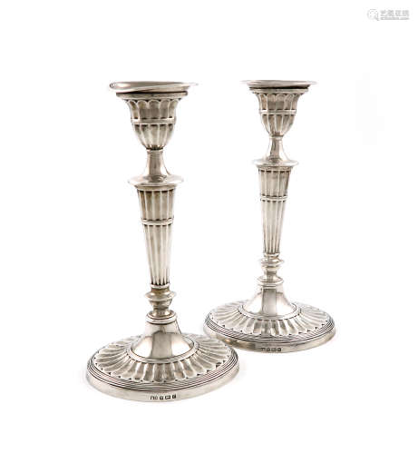 A pair of silver candlesticks, by The Barker Brothers, Sheffield 1922, tapering fluted oval form,