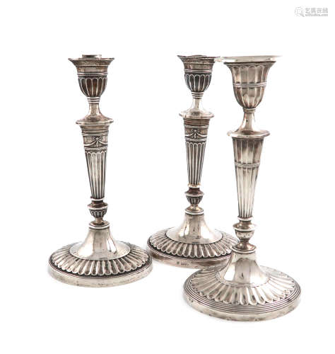 A pair of late-Victorian silver candlesticks, by Holland, Aldwinckle & Slater, London 1897, in the