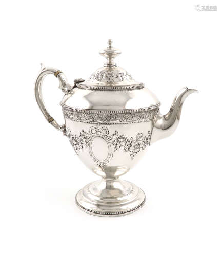 λA Victorian silver teapot, by Messrs. Lias, London 1872, vase form, embossed foliate decoration,