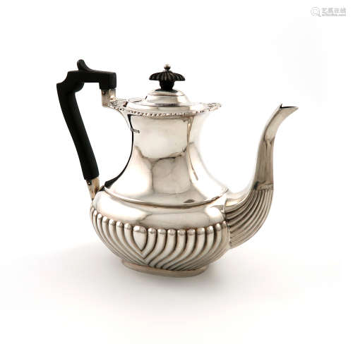 A silver coffee pot, by H. Atkins, Sheffield 1911, oblong bellied form, part-fluted decoration,