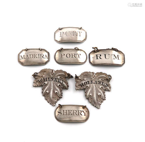 A mixed lot of George III and later silver wine labels, comprising: two of leaf form, pierced '