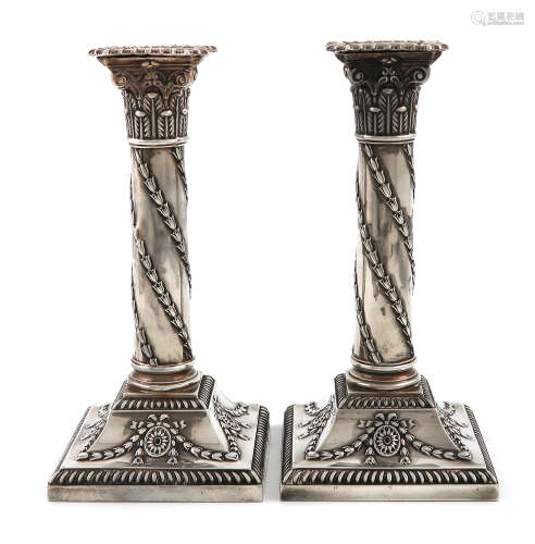 A pair of late-Victorian silver candlesticks, by H. Atkin, Sheffield 1899, Corinthian column form,