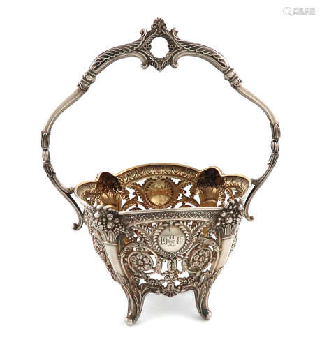 A continental silver swing-handled sugar basket, with a Russian import mark, circular tapering form,