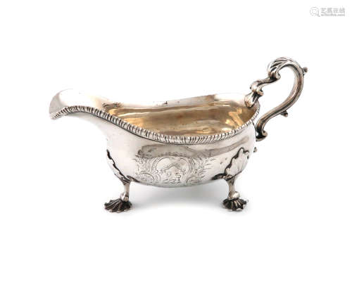 A Victorian silver sauce boat, by Frederick Brasted, London 1887, oval form, leaf capped scroll