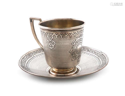 A 19th century Russian silver cup and saucer, assay master Viktor Savinkov, Moscow 1874, tapering