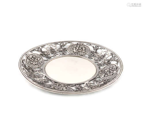 A French silver dish, circular form, pierced and chased with foliate scroll decoration and with four