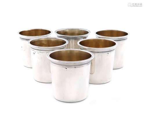 A set of six French silver tot cups, maker's mark of C.T, tapering circular form, gilded