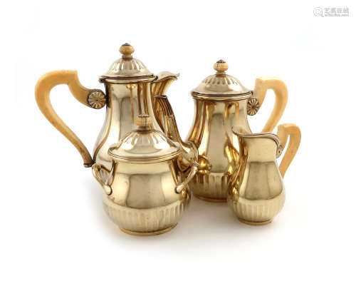 λA four-piece French silver-gilt bachelor's tea and coffee set, circa 1900, by R.L crowned for