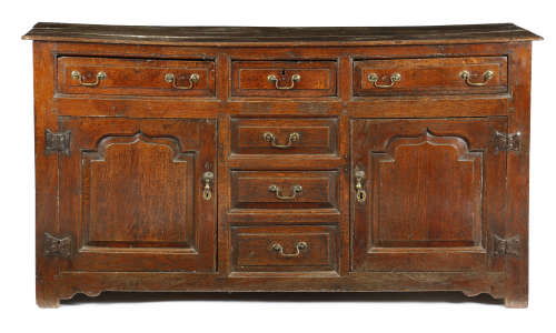 AN 18TH CENTURY OAK DRESSER PROBABLY WELSH, c.1750 the boarded top above three panelled front frieze