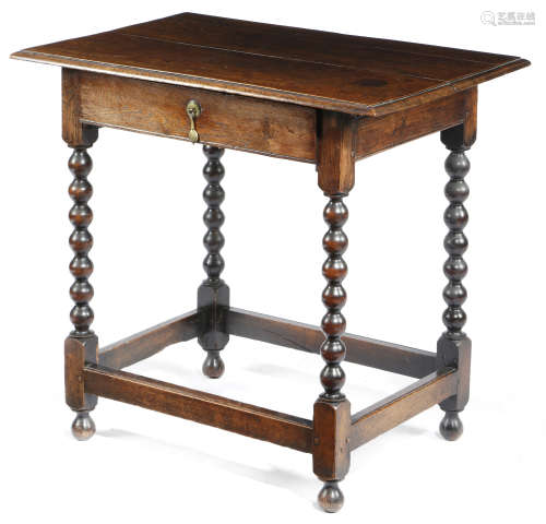 A WILLIAM AND MARY OAK SIDE TABLE LATE 17TH / EARLY 18TH CENTURY the boarded top with a moulded edge