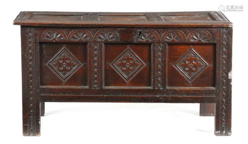 A CHARLES II OAK COFFER LATE 17TH CENTURY the triple panelled hinged top revealing a till, the front