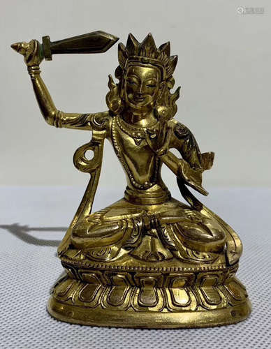 A TIBETAN GILT BRONZE MANJUSRI