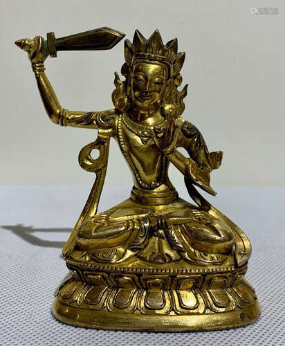 A TIBETAN GILT BRONZE MANJUSRI