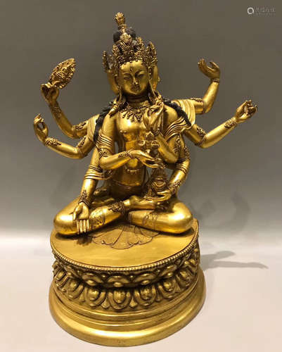 A GILT BRONZE TARA