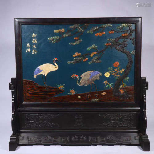 A ZITAN WOOD SCREEN CARVED WITH PINE AND CRANE