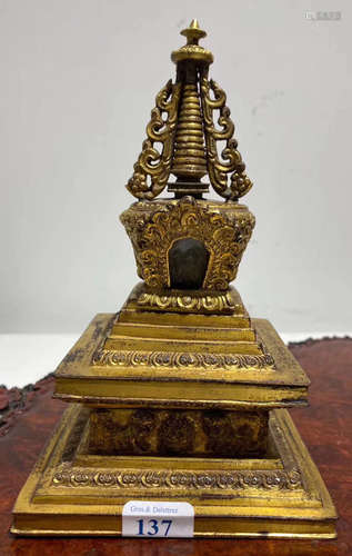 A GILT BRONZE STUPA WITH LION PATTERN