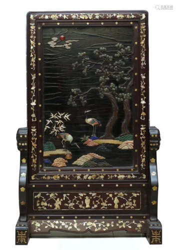 A ZITAN WOOD SCREEN CARVED WITH PINE AND CRANE