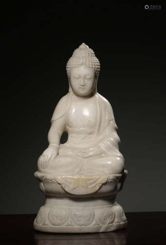 A Chinese Carved White Jade Seated Guanyin Statue