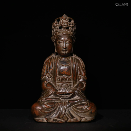 A CHINESE CARVED EAGLEWOOD GUANYIN …
