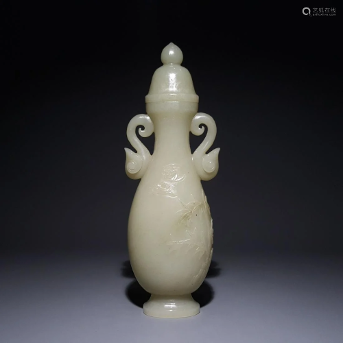 A CHINESE HETIAN JADE DOUBLE EARS ORN…